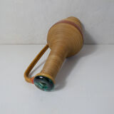 Old bottle dressed in vintage wood rattan