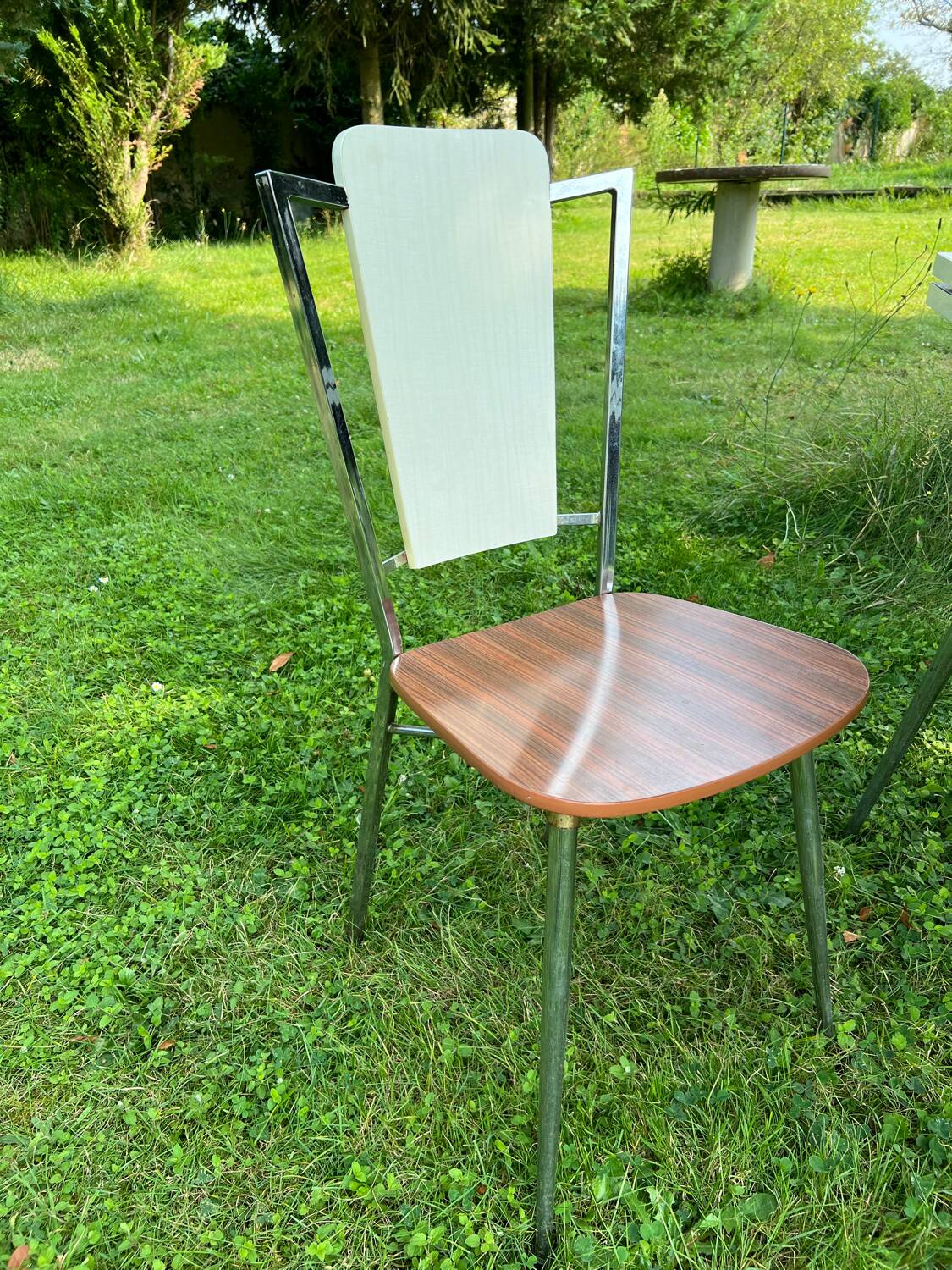 White Formica table with extensions and 2 designer chairs