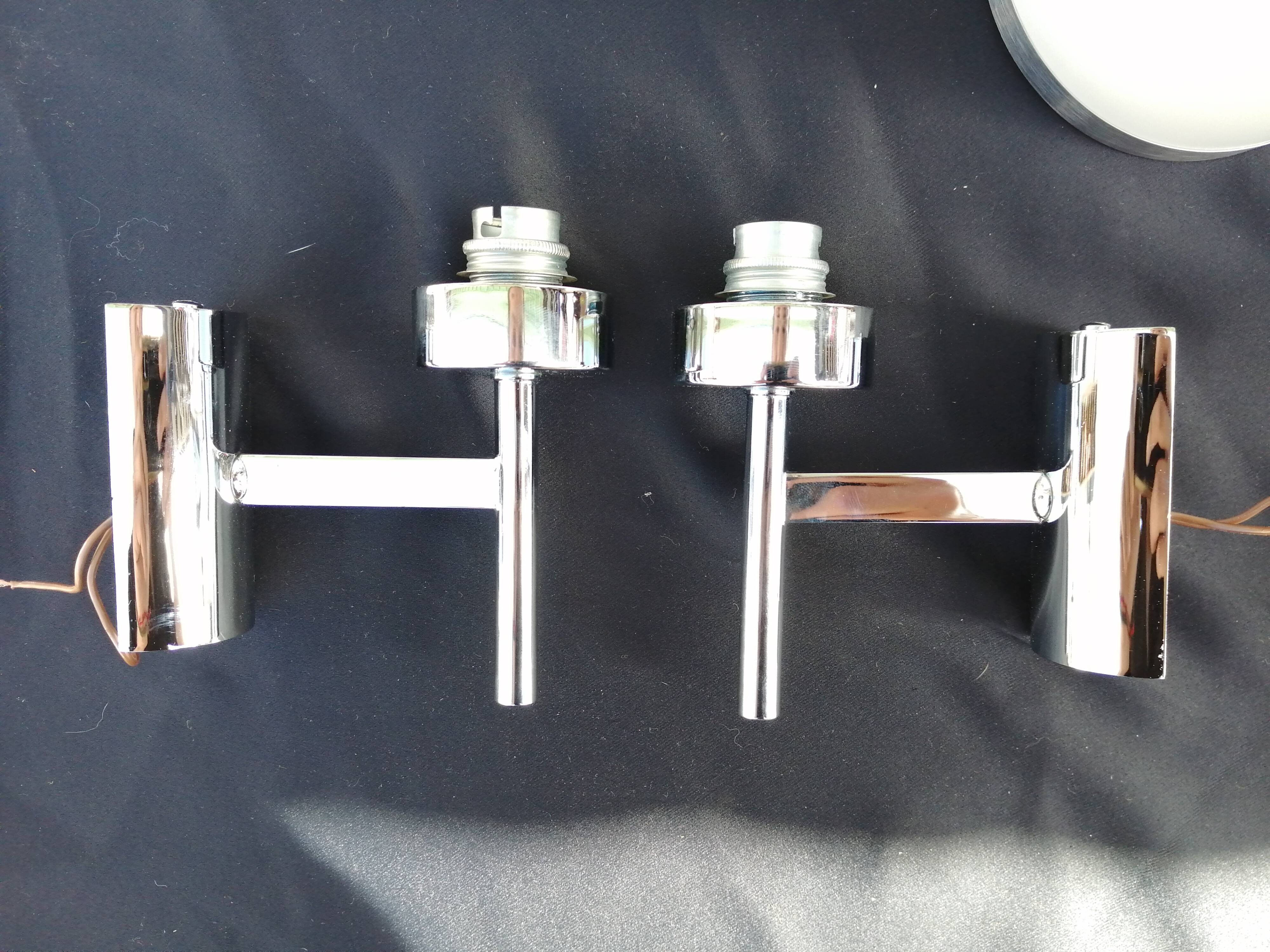 Pair of chrome design wall lights and vintage white hat 1970