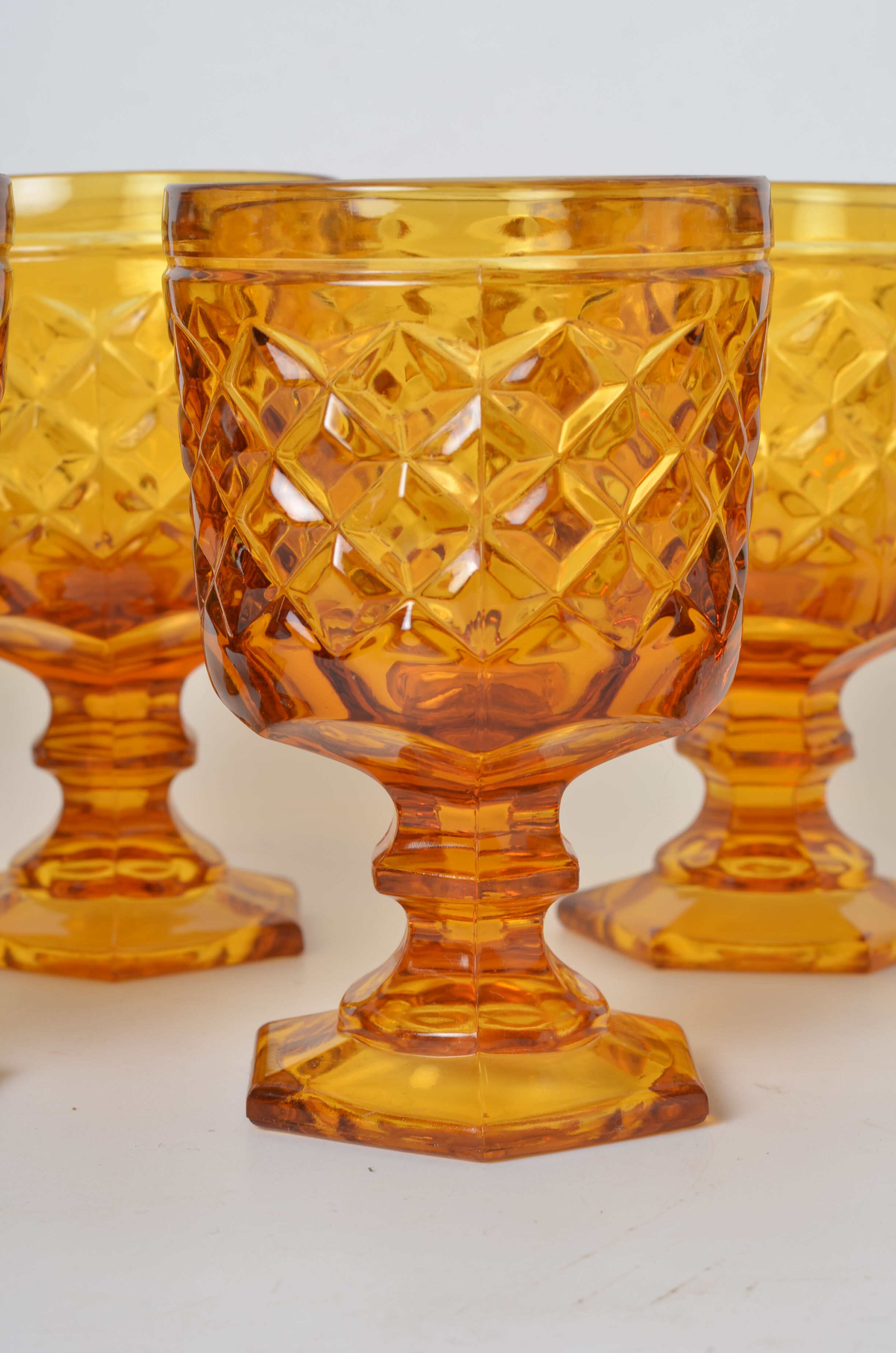 7 amber stemmed glasses