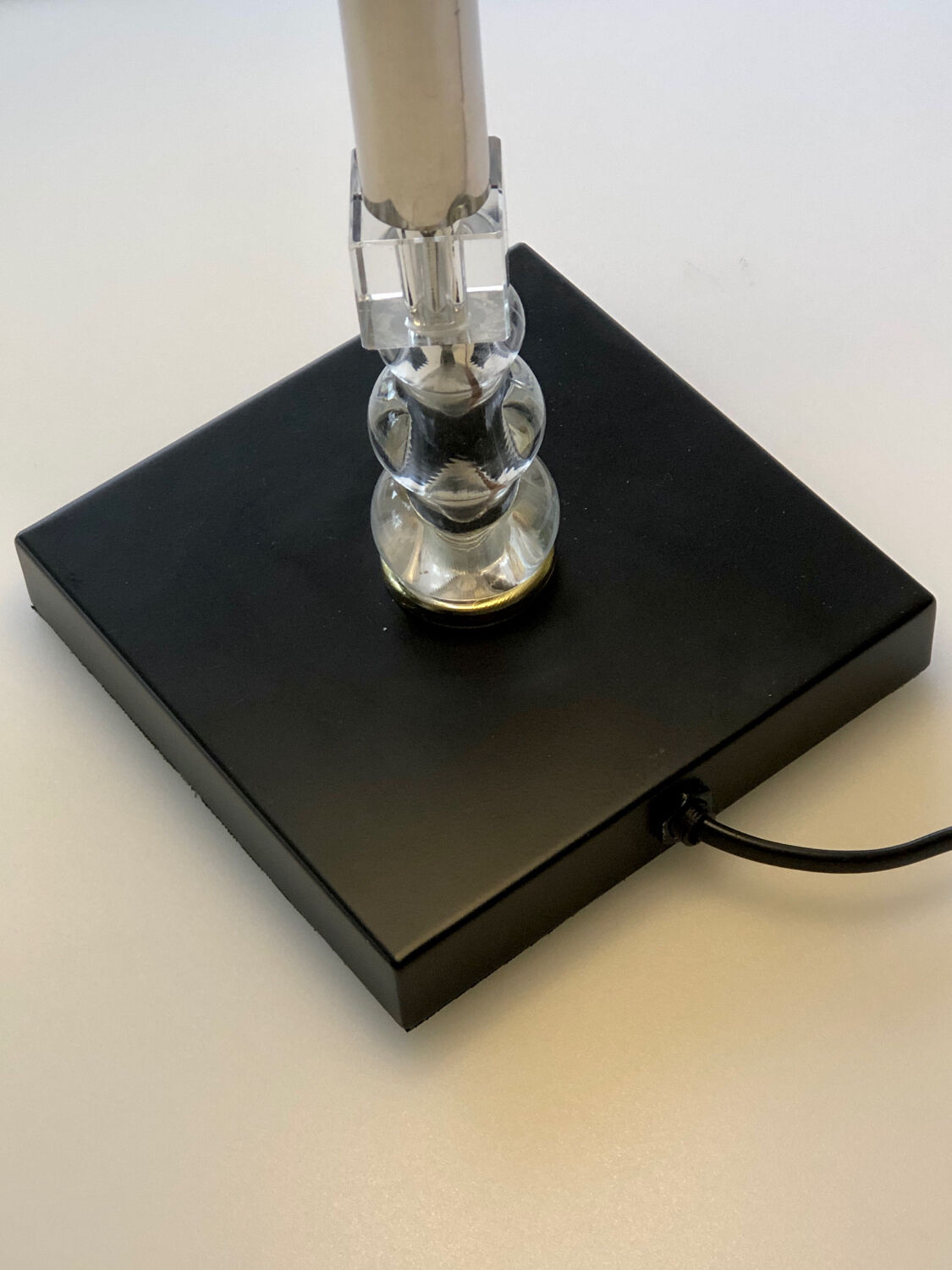 Silver floor lamp with a straight shade.