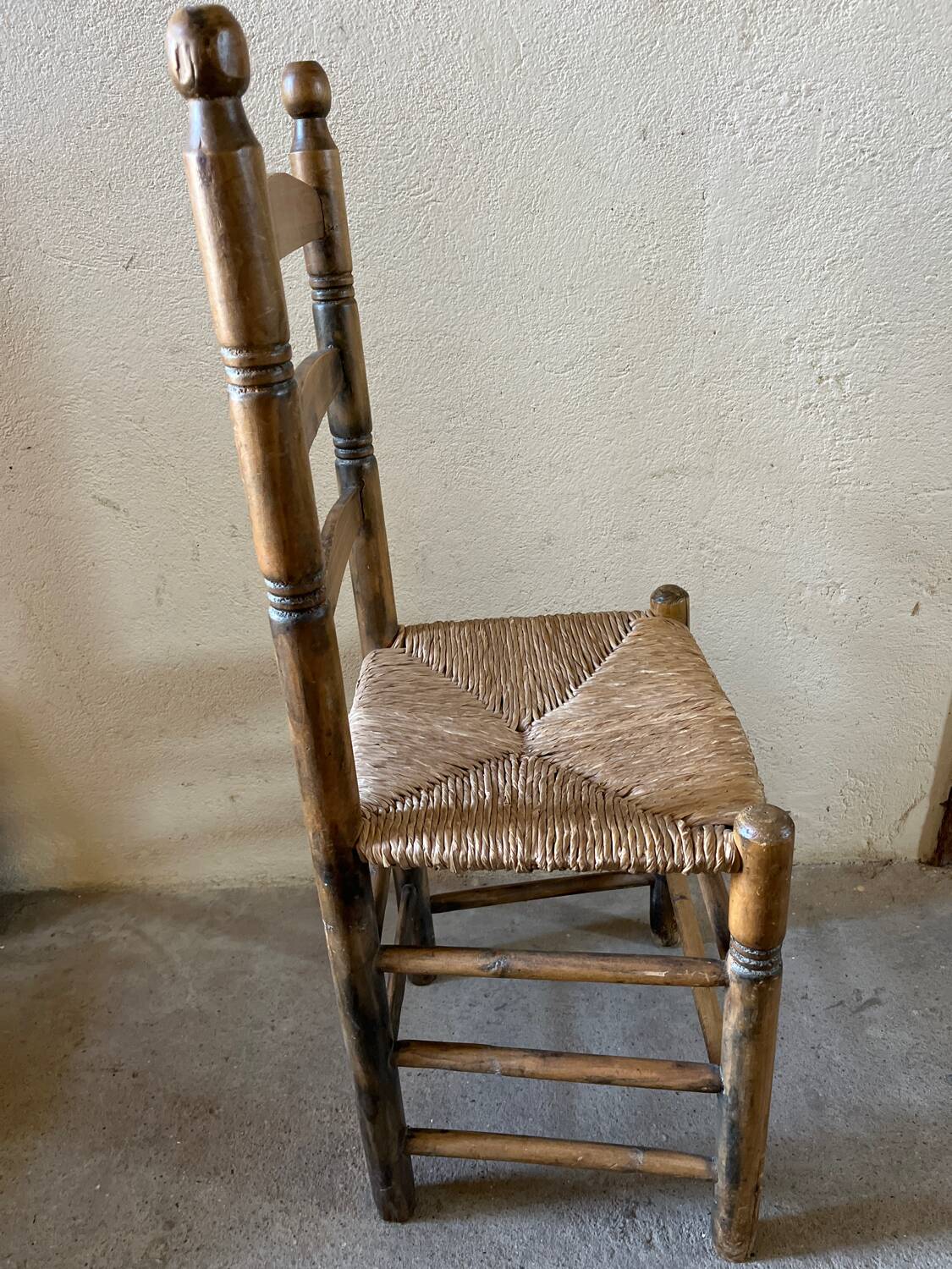 Old turned and stuffed wooden chair