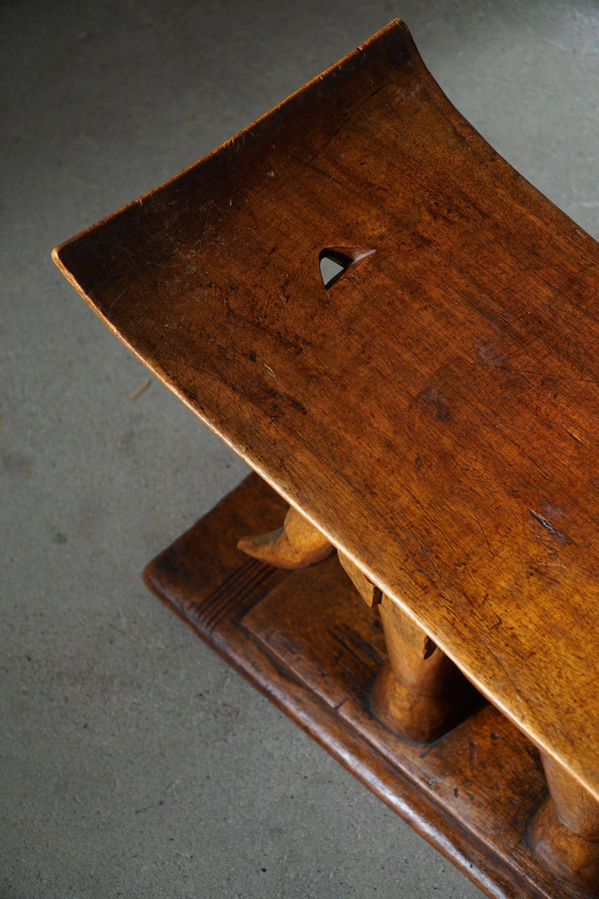 African elephant stool in carved wood, mid-century in Wabi Sabi style, 1940s.