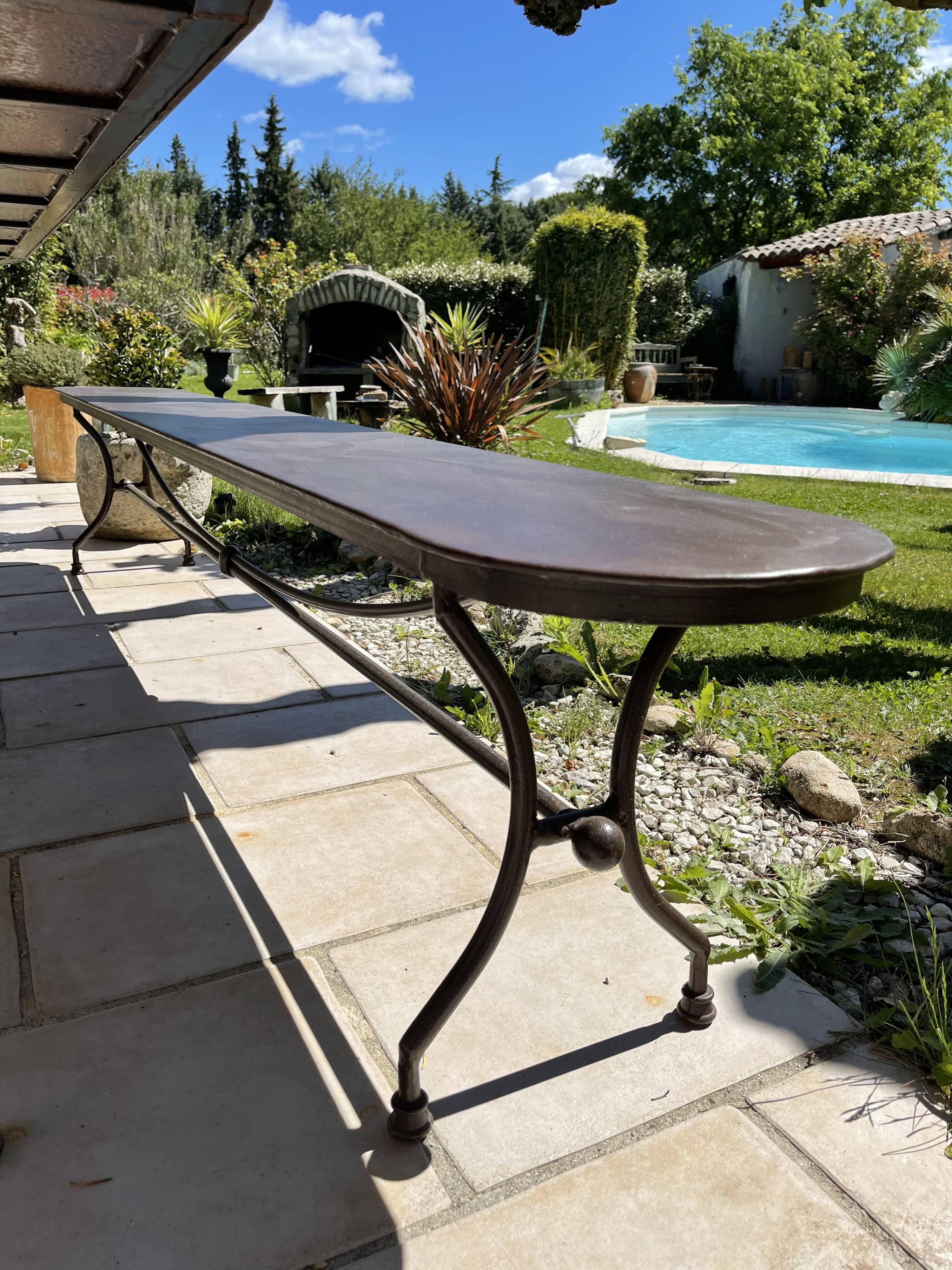 Artisanal wrought iron garden bench