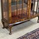 English Chippendale walnut display cabinet from the 1930s