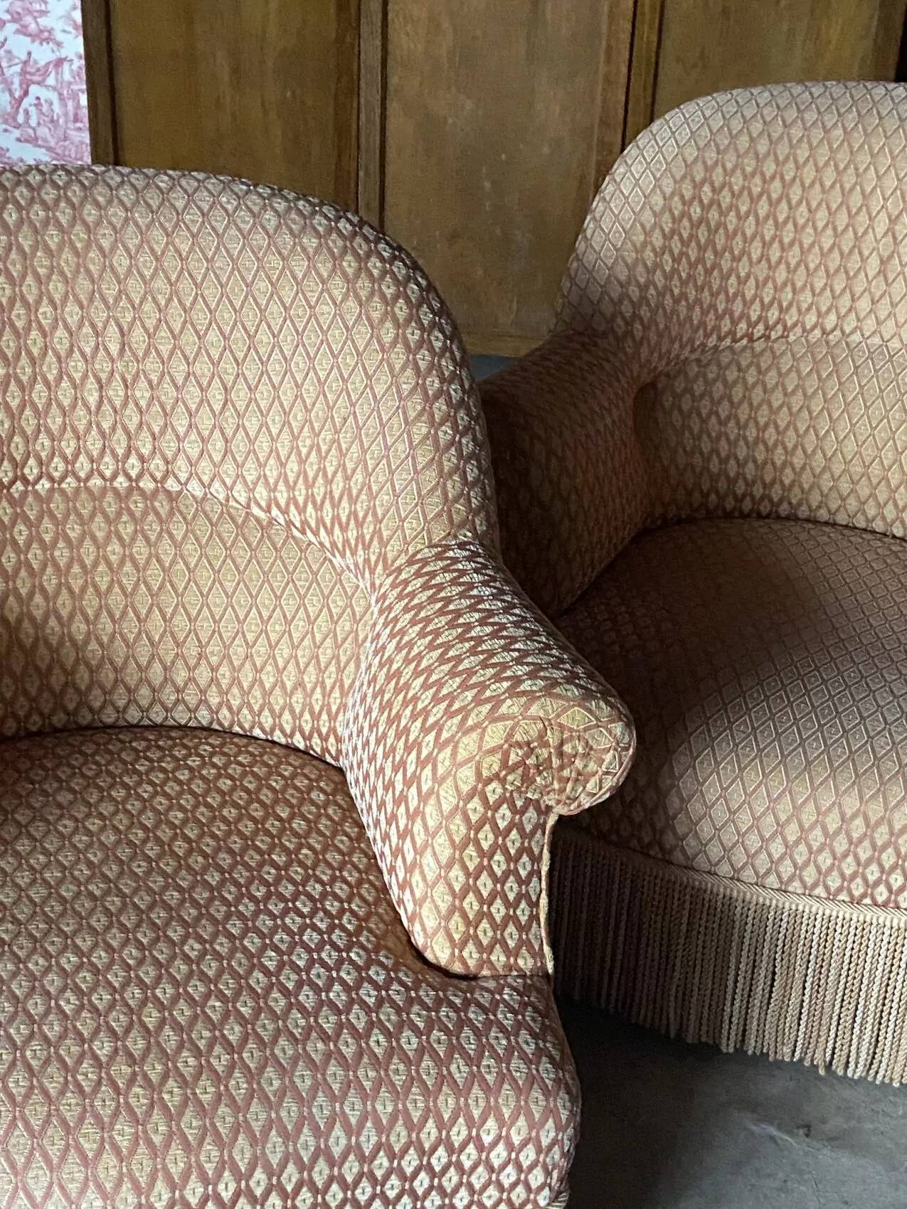 Pair of renovated upholstered frog chairs in beige velvet.