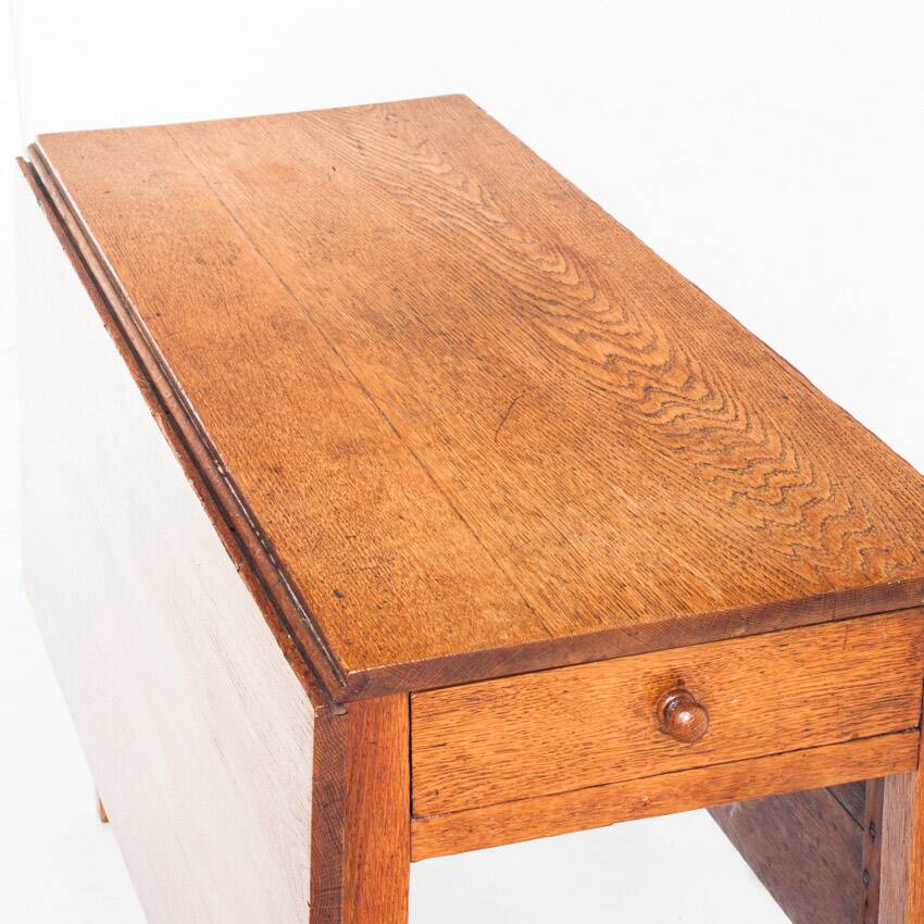 Vintage table with two folding leaves. Solid oak wood. France, 1940s