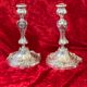 Pair of candlesticks, torches in silver bronze