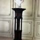 A pedestal table in blackened wood and burl veneer, superb assembly of moldings circa 1880
