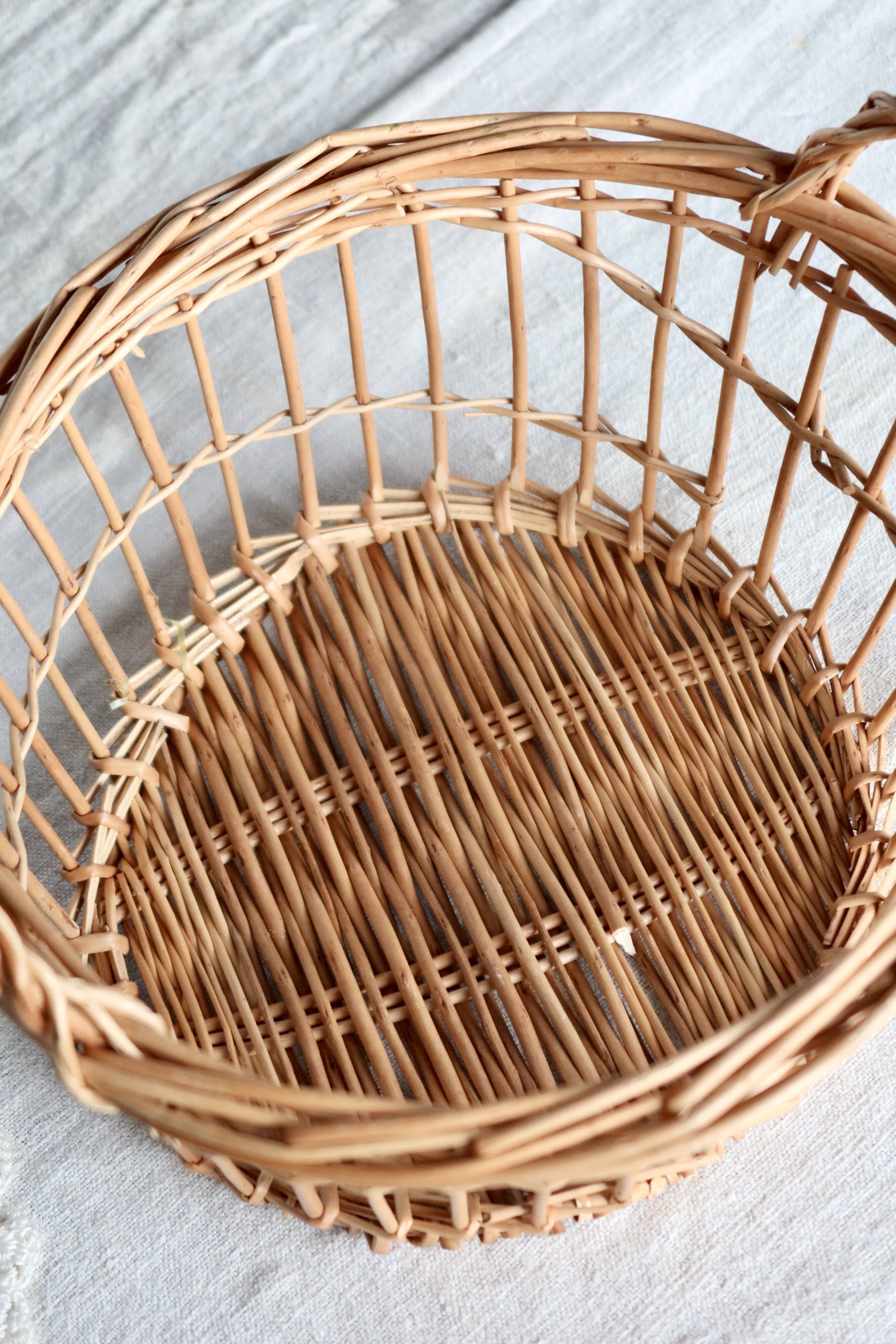 Round openwork wicker storage basket with braided handles