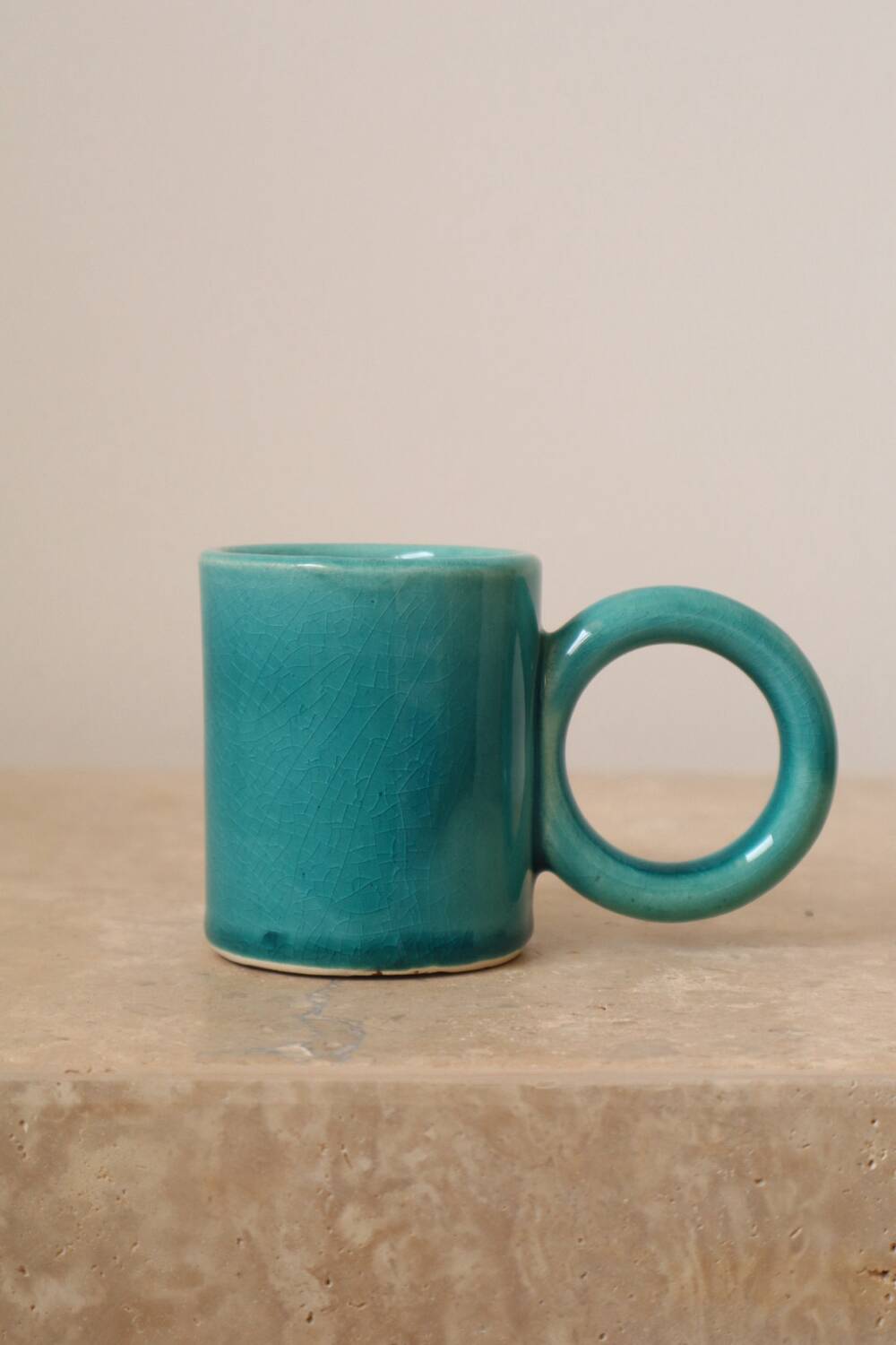 Pair of handmade turquoise ceramic coffee cups with large handles