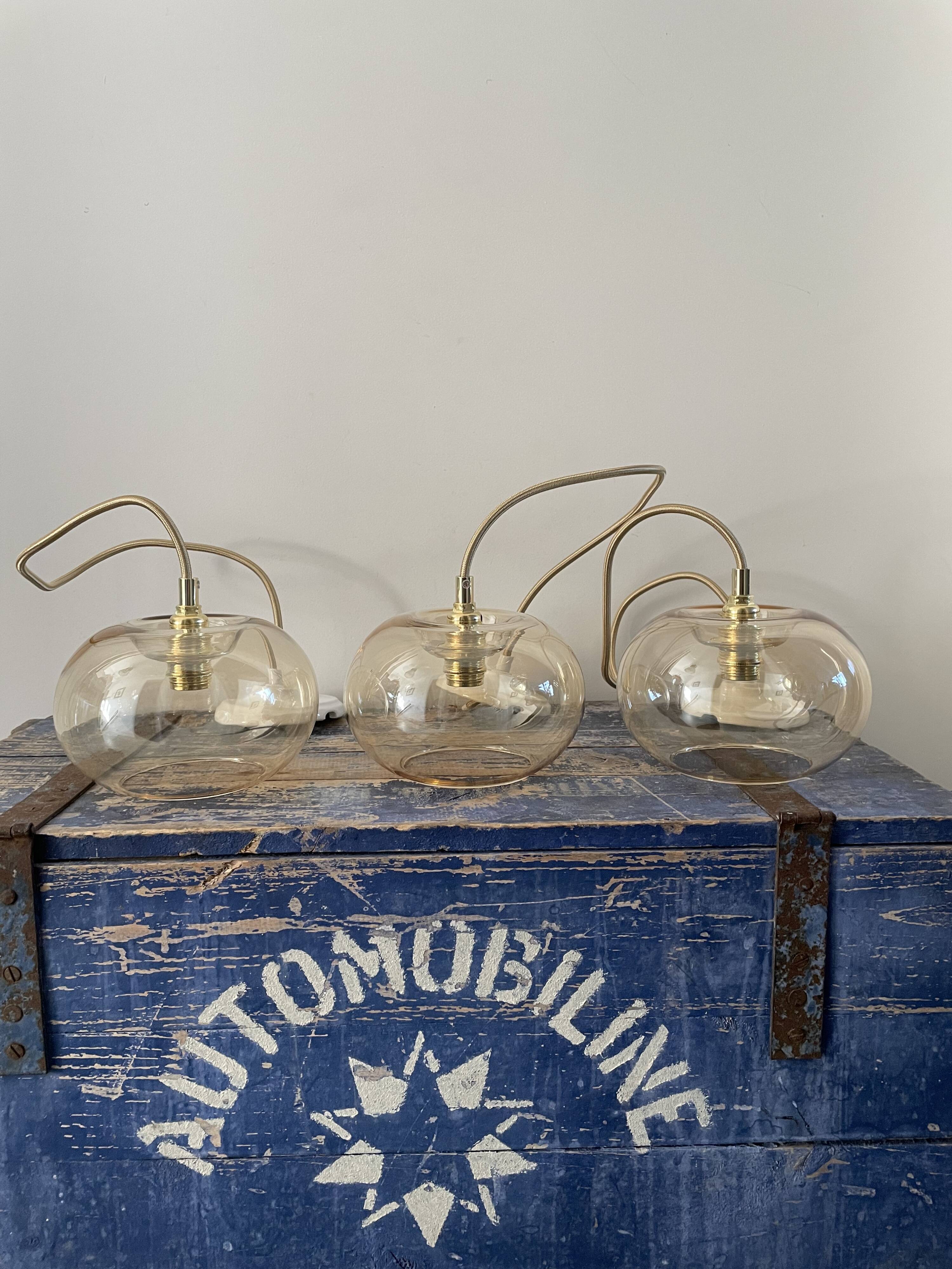 Set of three glass hanging lamps