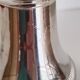 Silver-plated sugar shaker with fluted edges