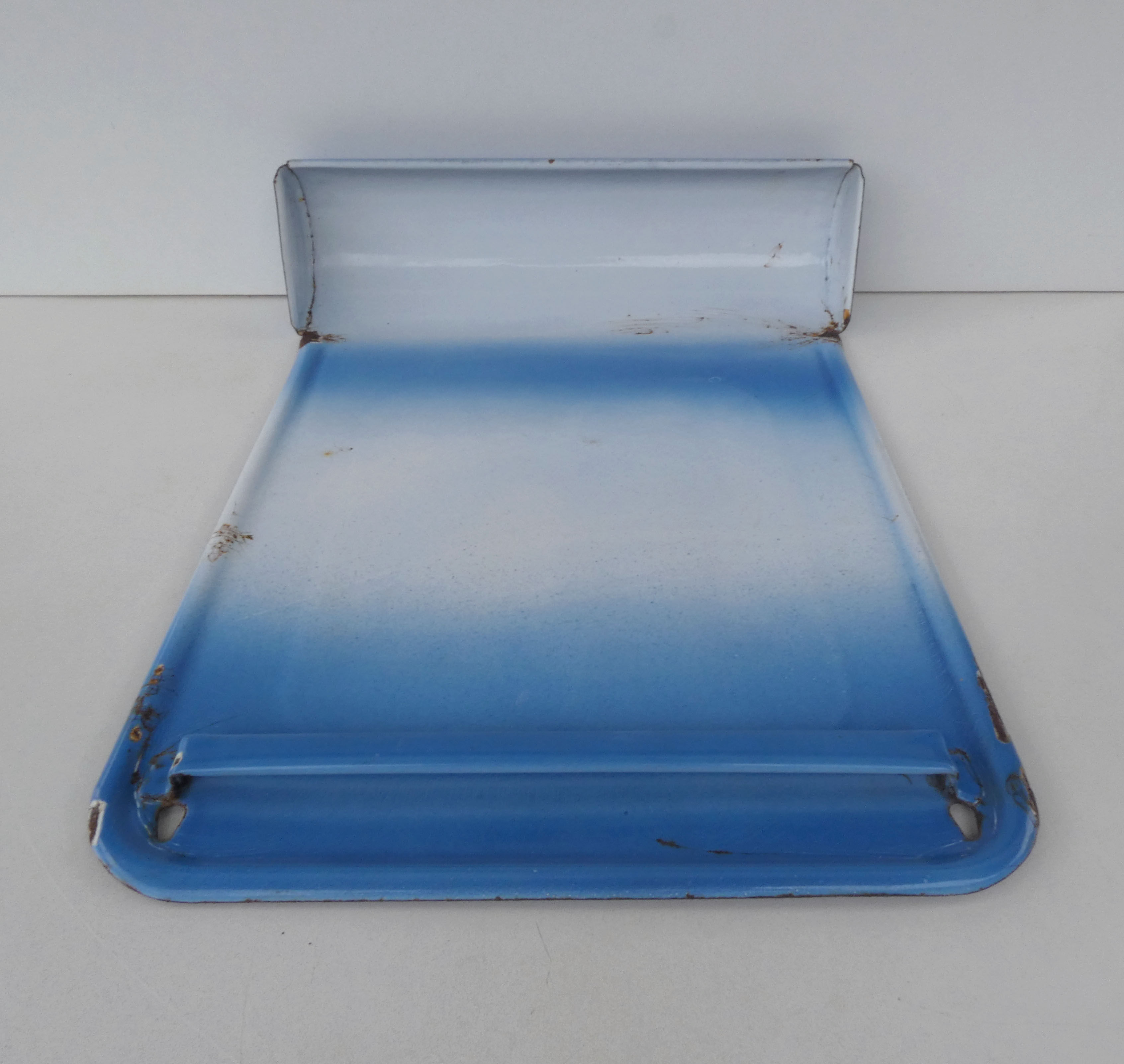 old blue enamelled steel utensil drainer