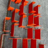 Large modular bookcase shelf in orange thermoformed wood circa 1970