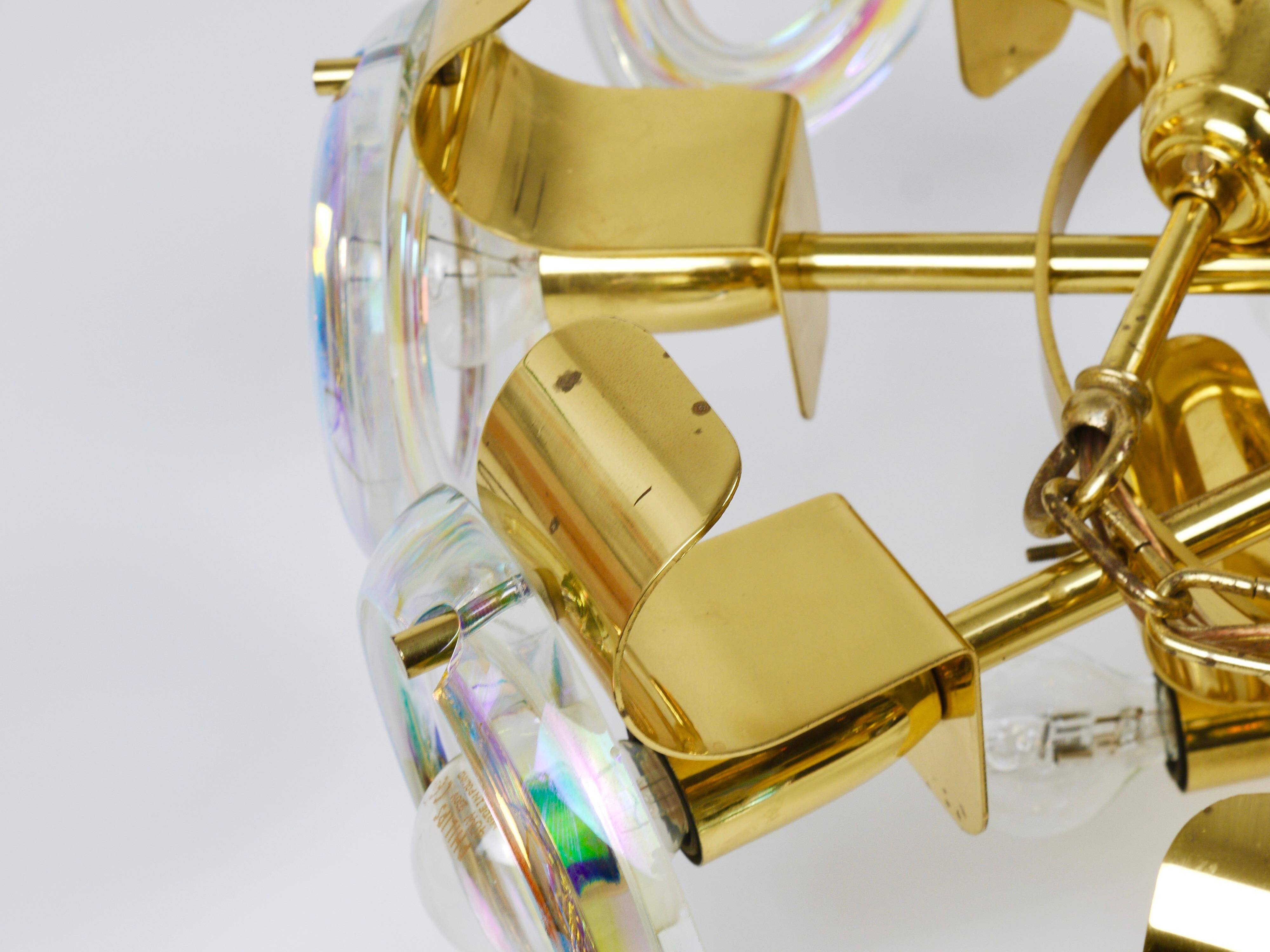 Large brass chandelier by Oscar Torlasco, rainbow optical glass rings, Italy, 1970s.