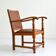 Antique brutalist oak and vinyl armchair