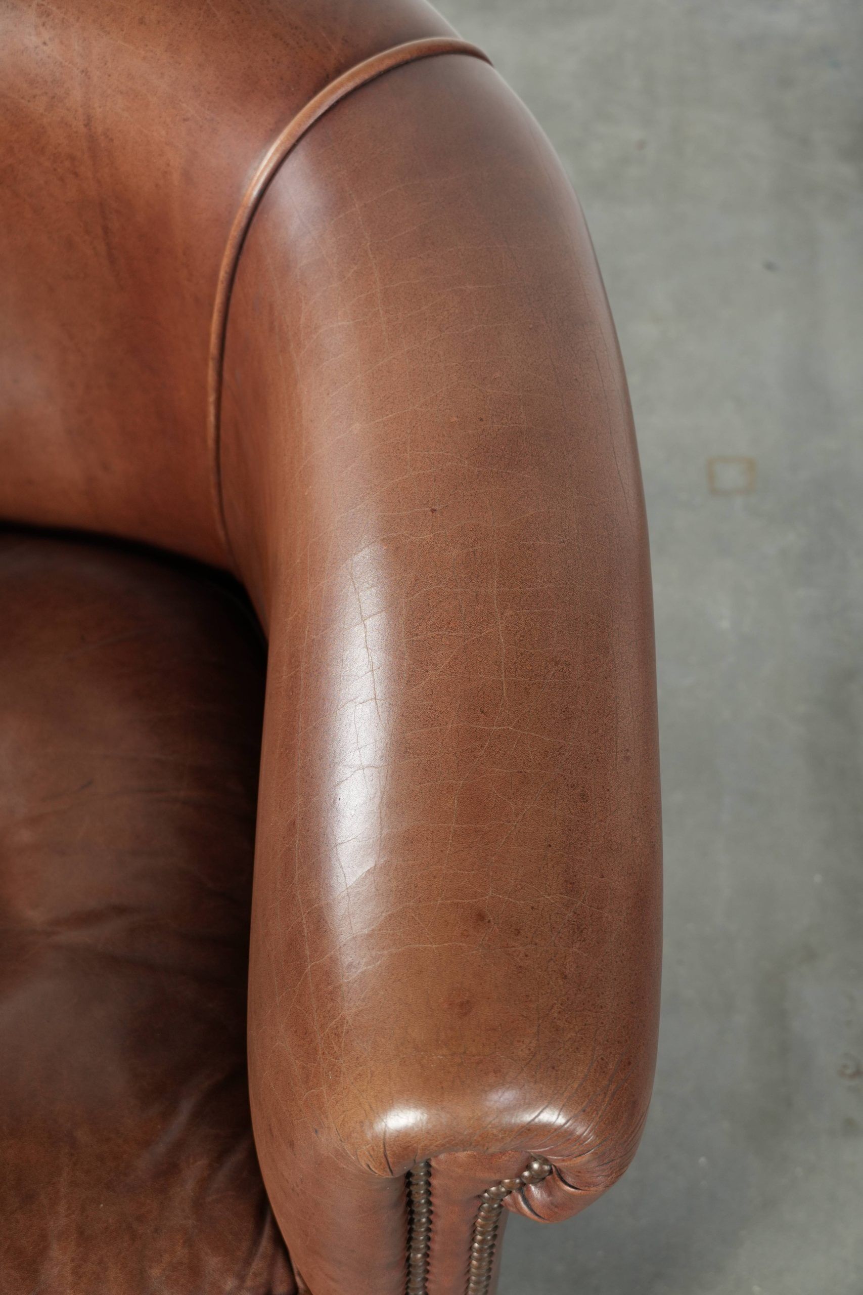 Cow leather club armchair in beautiful dark cognac colour in English style