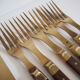 Set of old dessert cutlery in wood and brass