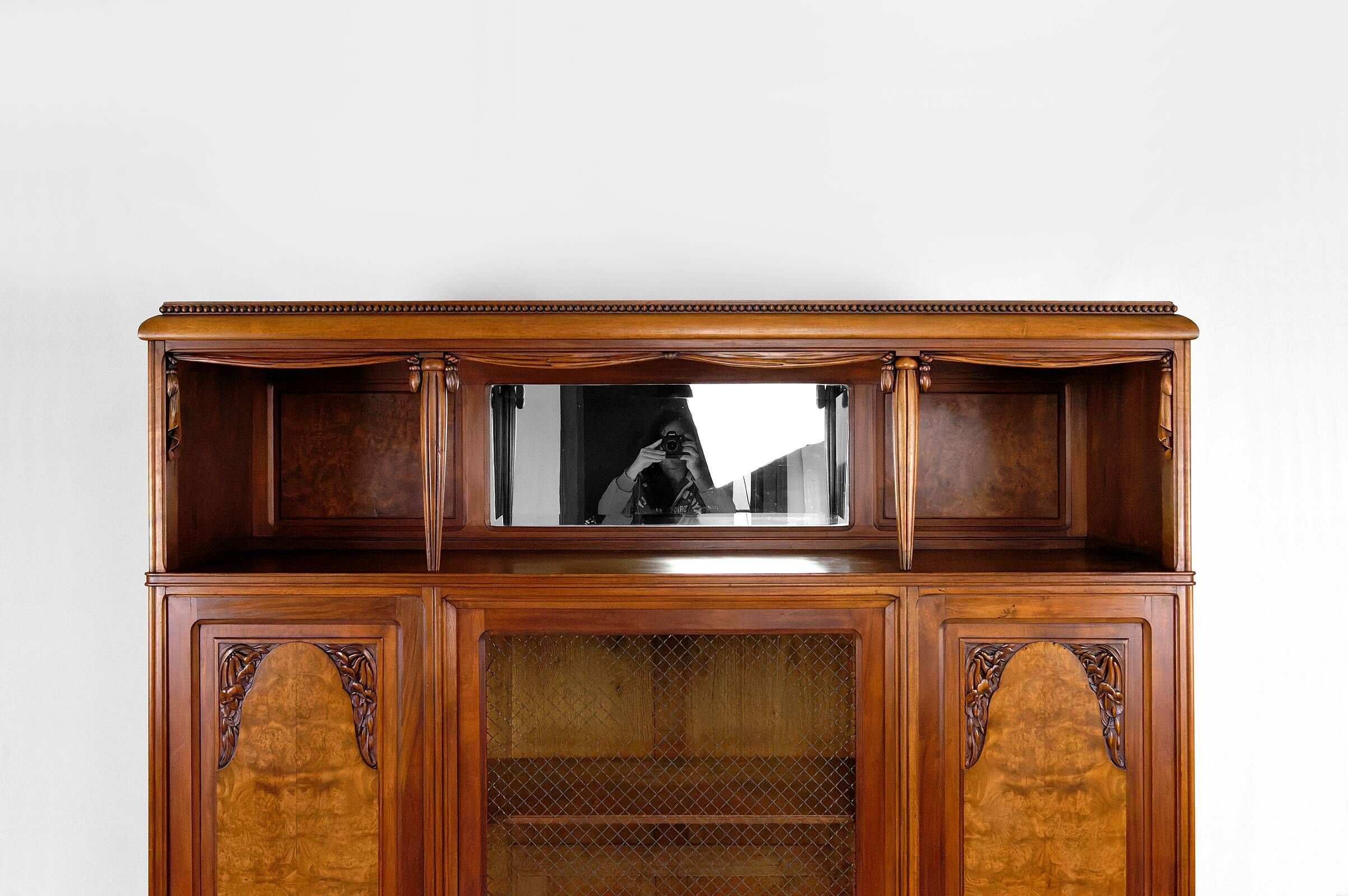 Art Deco showcase bookcase in carved walnut, France, circa 1925