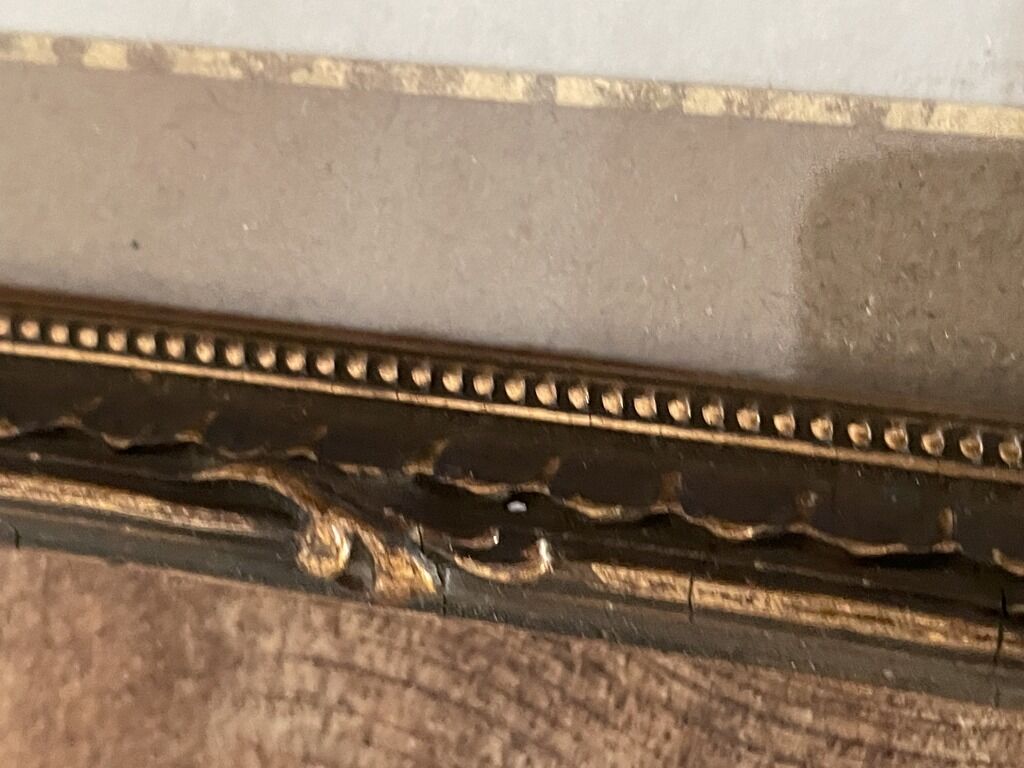 Old wood frame with a gold finish