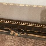Old wood frame with a gold finish