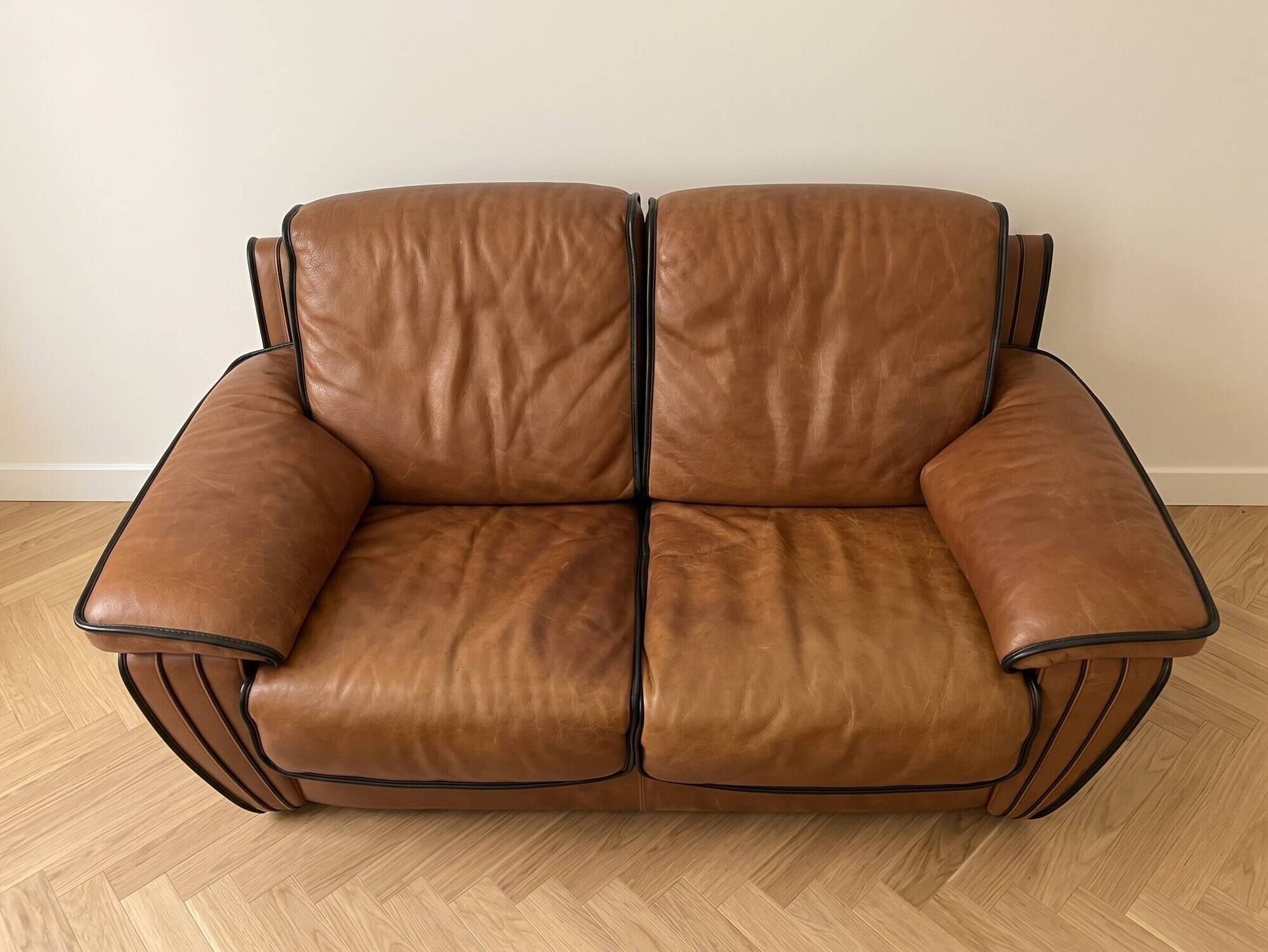 Vintage 1970s brown leather two-seater sofa