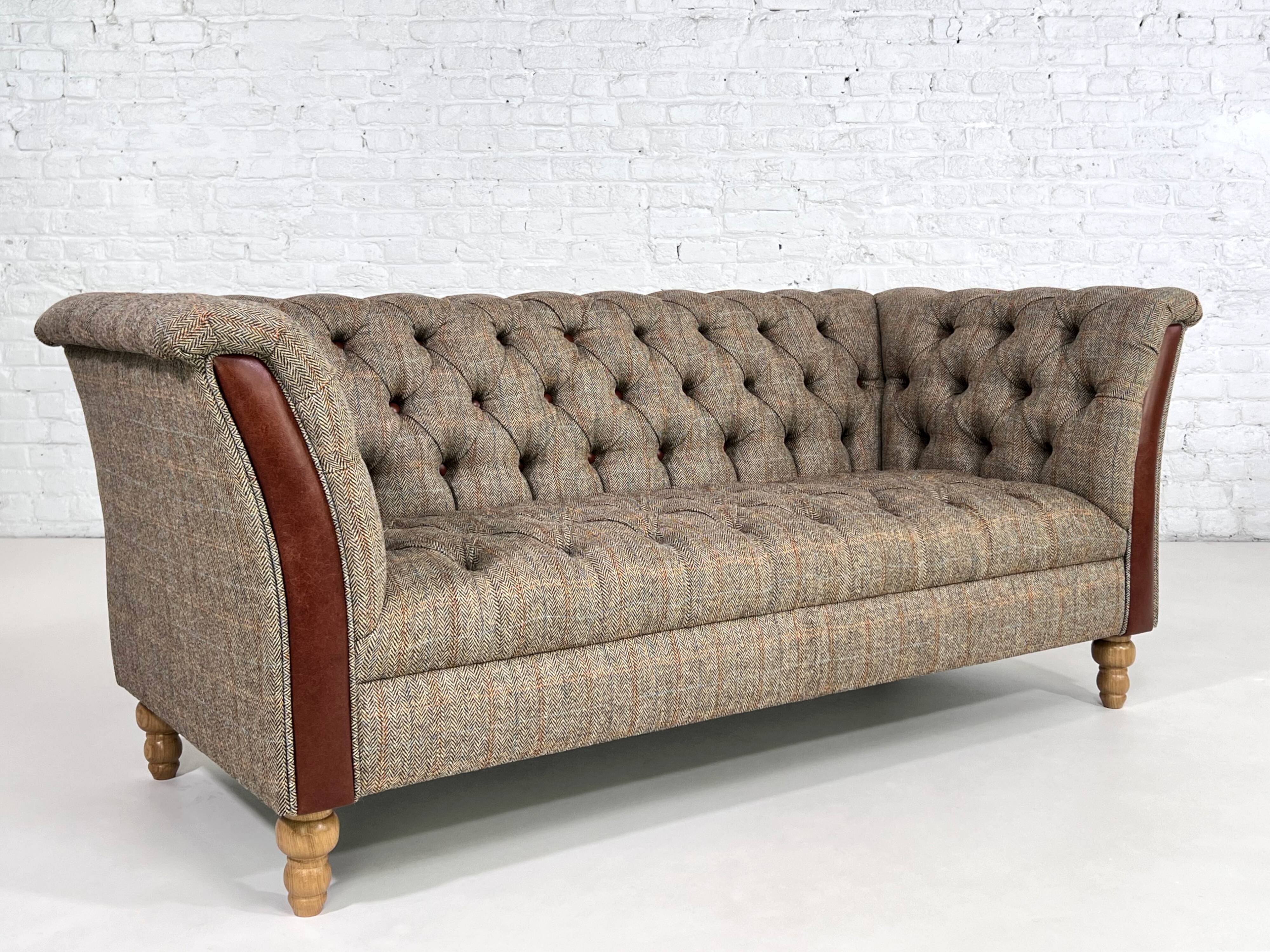 Chesterfield sofa in leather, fabric and wood