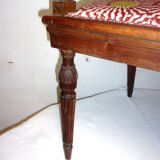 A Chair from the beginning of the 20th century in natural wood.