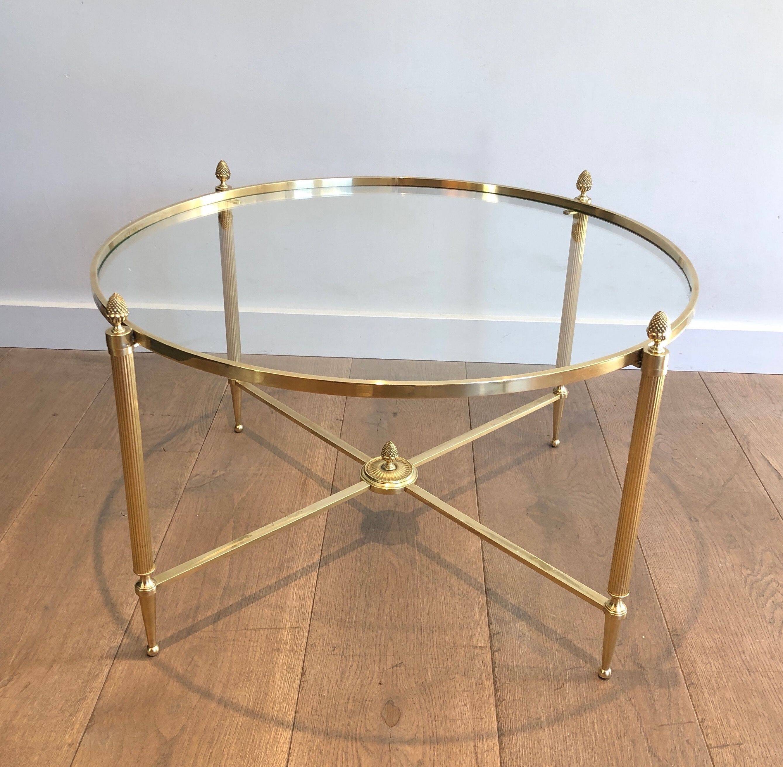 Round brass coffee table. Maison Baguès