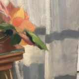 Table bouquet of roses in front of the window