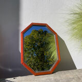 Octagonal beaded wooden mirror