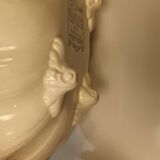 Old earthenware dish on foot
