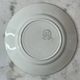 Set of 2 Saint Amand plates with laurel crown decoration.