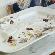 Very large rectangular dish with scalloped edges, made of fine glazed earthenware.