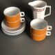 Hot chocolate cups and milk jar