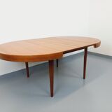 Large vintage Scandinavian round table from the 50s 60s in teak with extensions