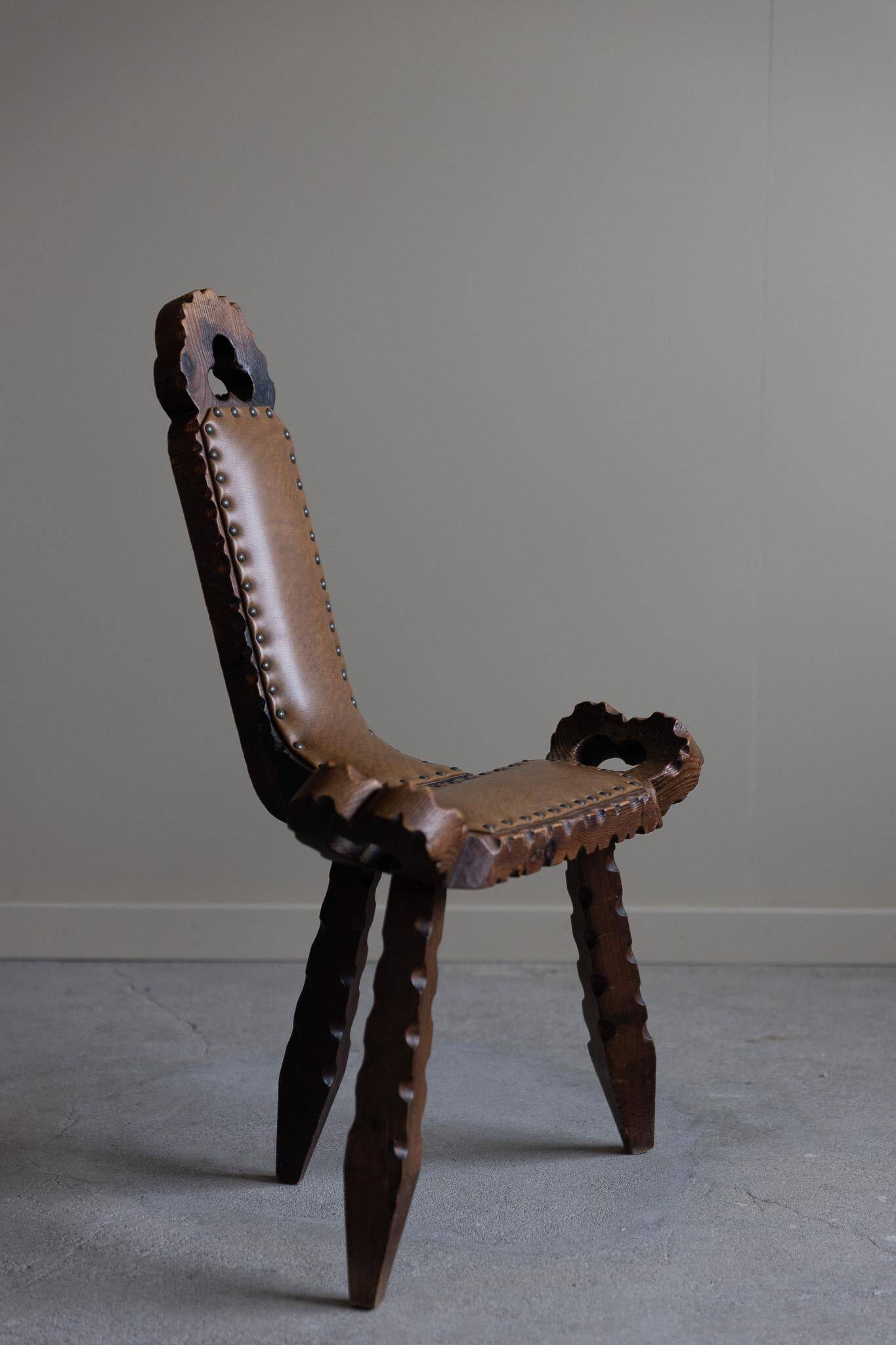 Carved wooden tripod chair with leather seat, Wabi Sabi, early 20th century.