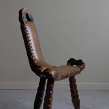 Carved wooden tripod chair with leather seat, Wabi Sabi, early 20th century.