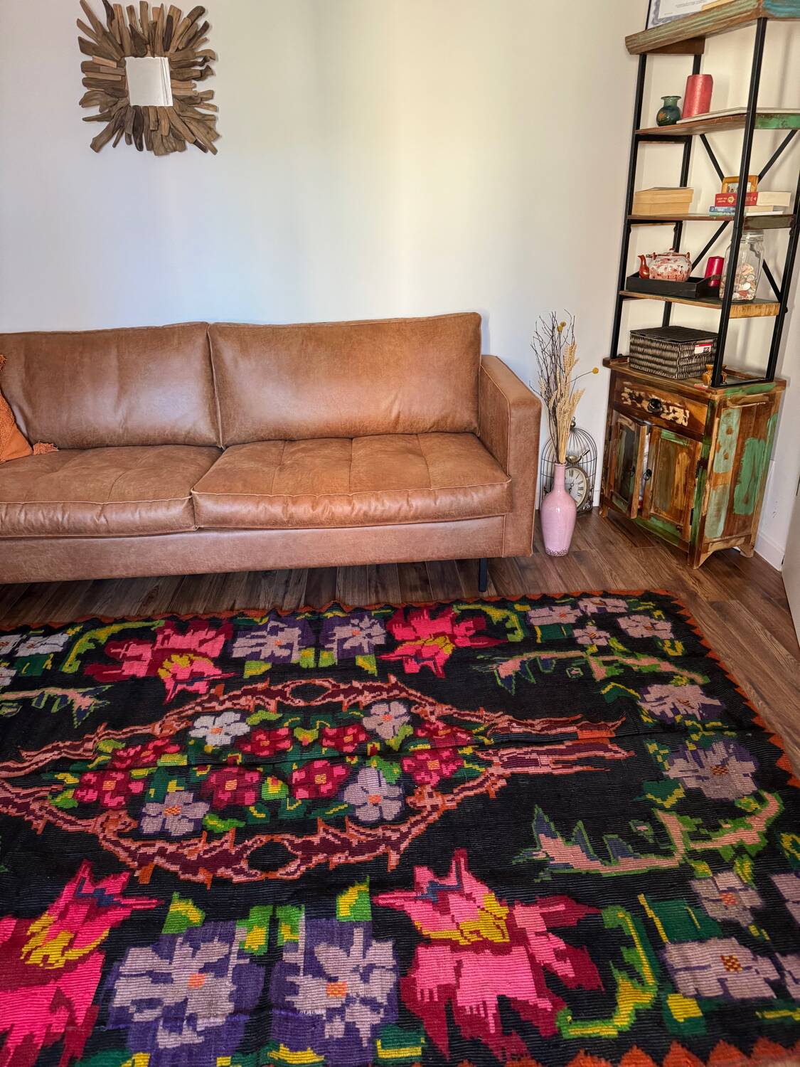 Bohemian floral design, handwoven wool rug, black background with colorful flowers