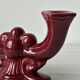 Pair of 1950s burgundy earthenware candlesticks