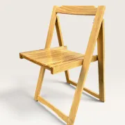 Blonde wooden folding chair in the style of Aldo Jacober.