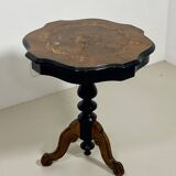 Two-tone black and mahogany pedestal table with mahogany veneer