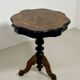 Two-tone black and mahogany pedestal table with mahogany veneer