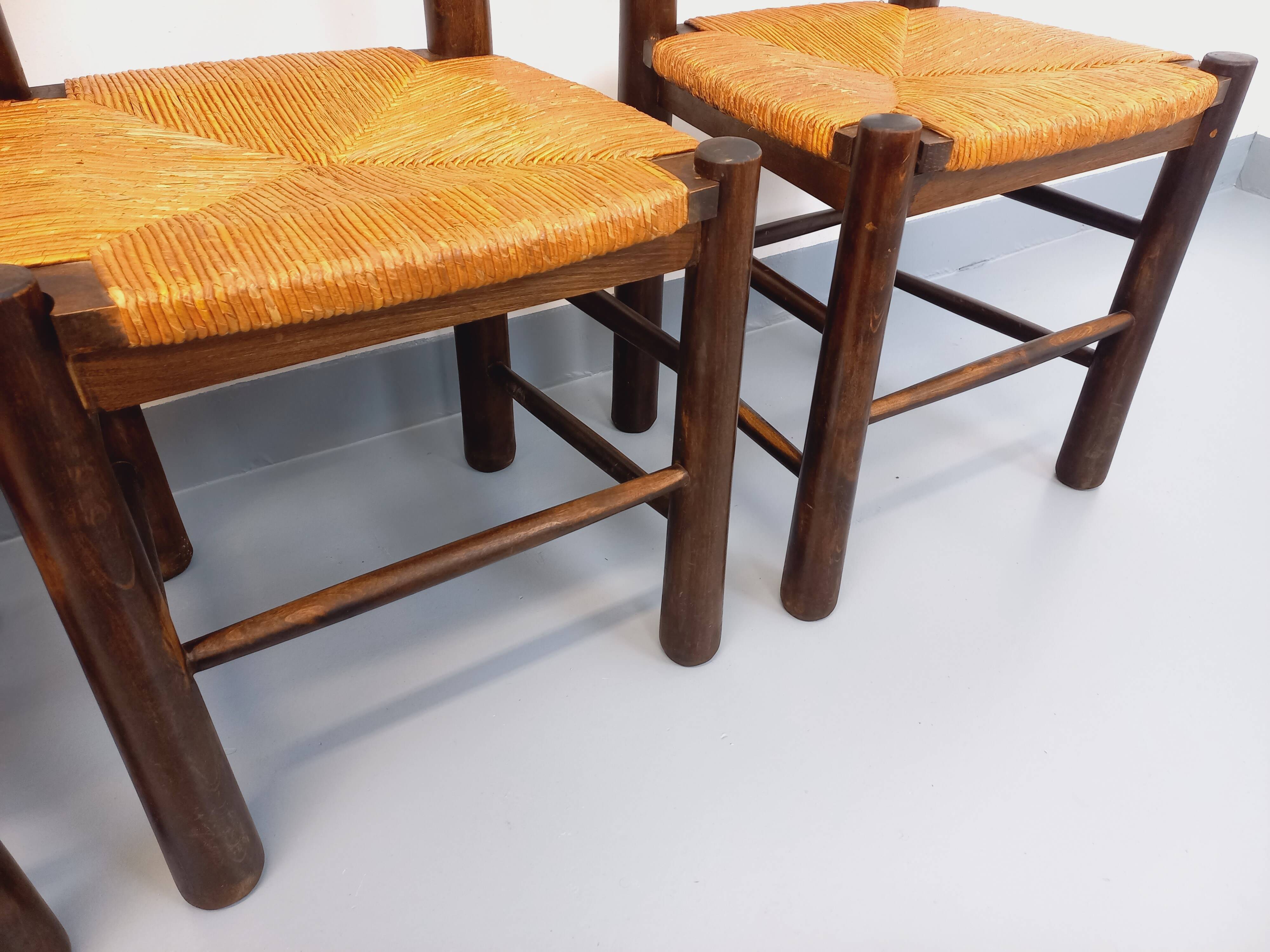 Set of 4 vintage brutalist chairs by Georges Robert in wood and straw.