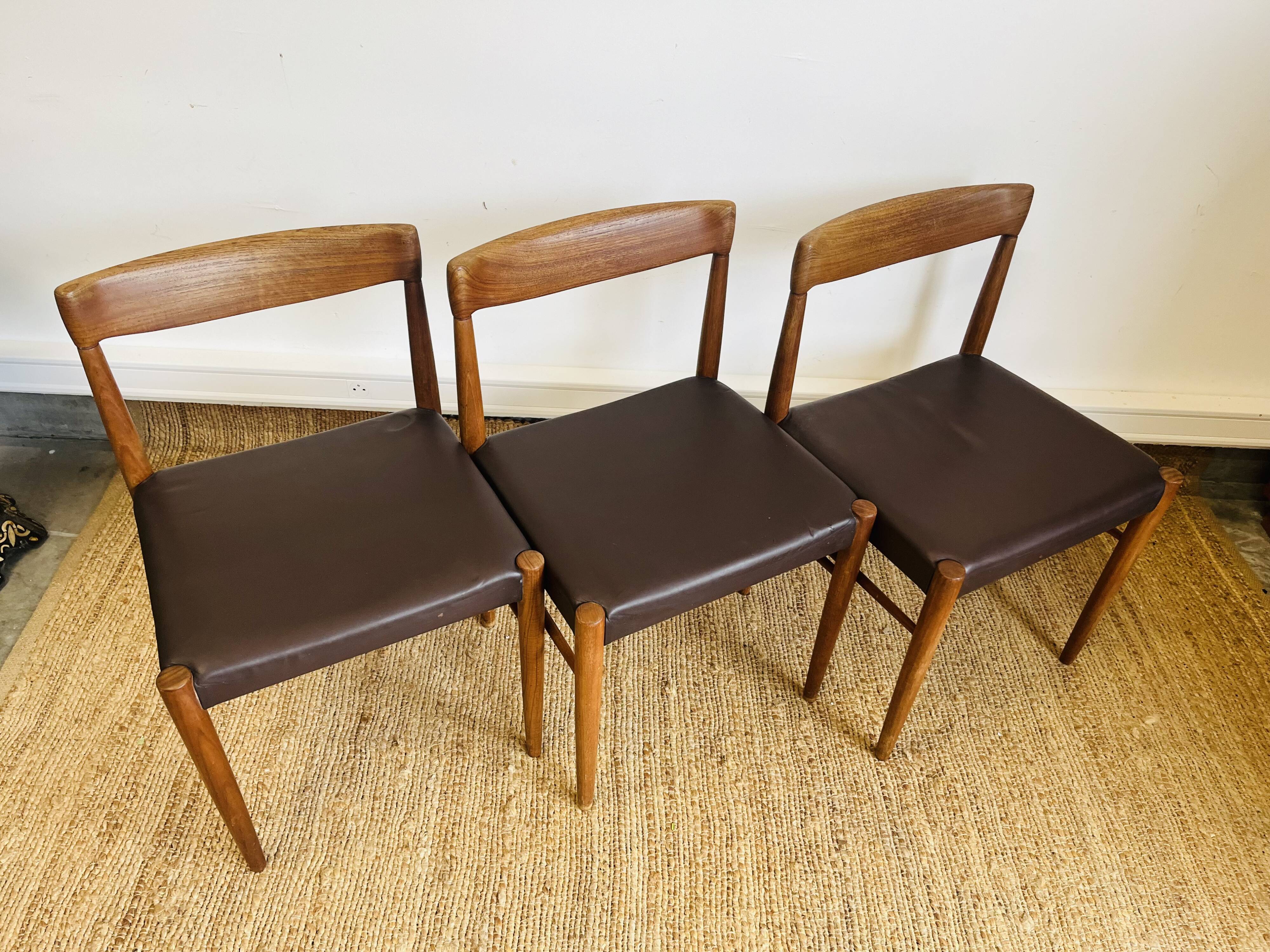 3 vintage Scandinavian chairs in teak and brown leatherette