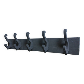 Antique painted wooden coat rack with 5 hooks.