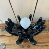 Lamp hands holding a globe