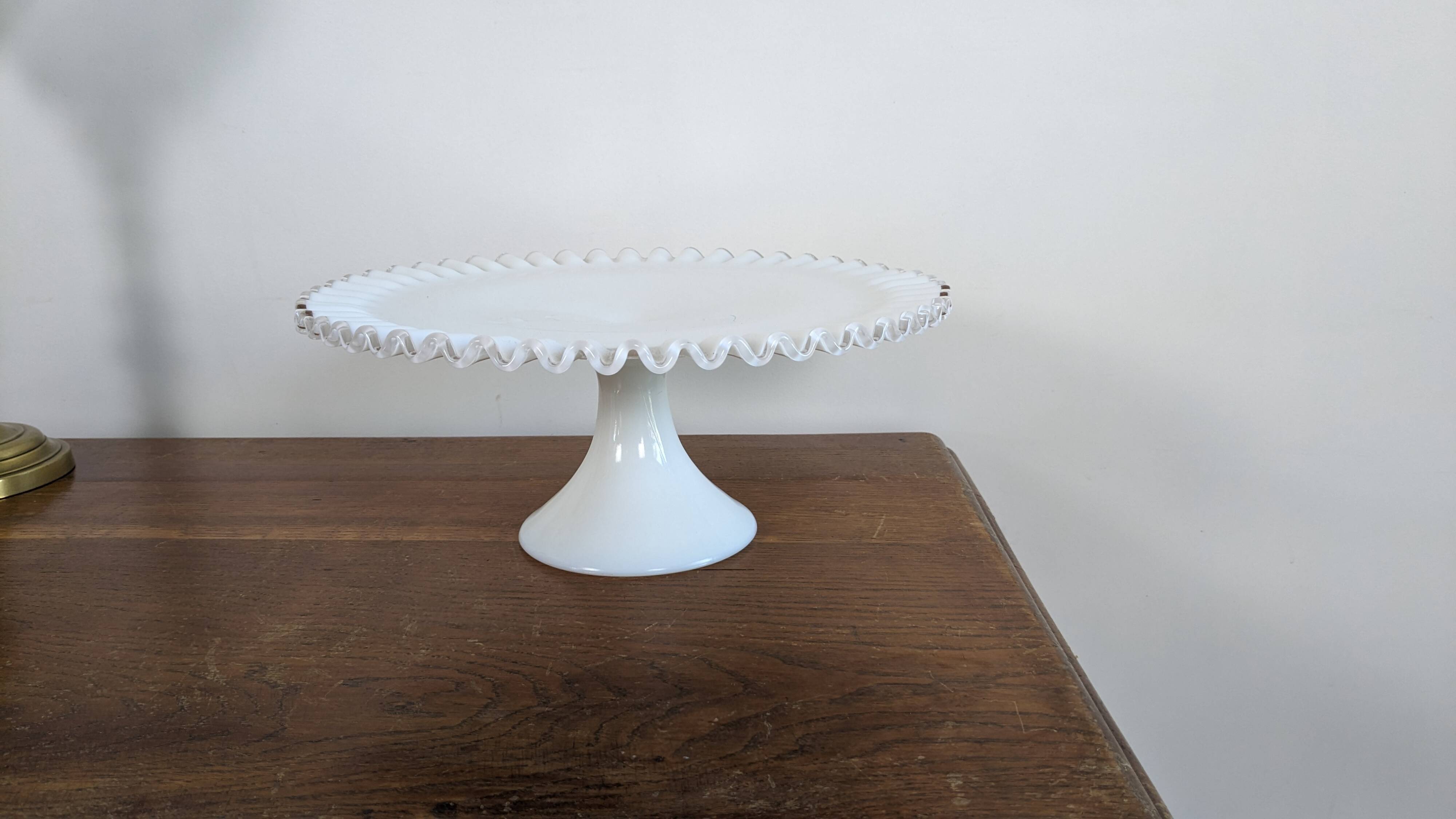 Antique white opal glass display stand with serrated edges