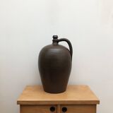 Ancient varnished sandstone jug